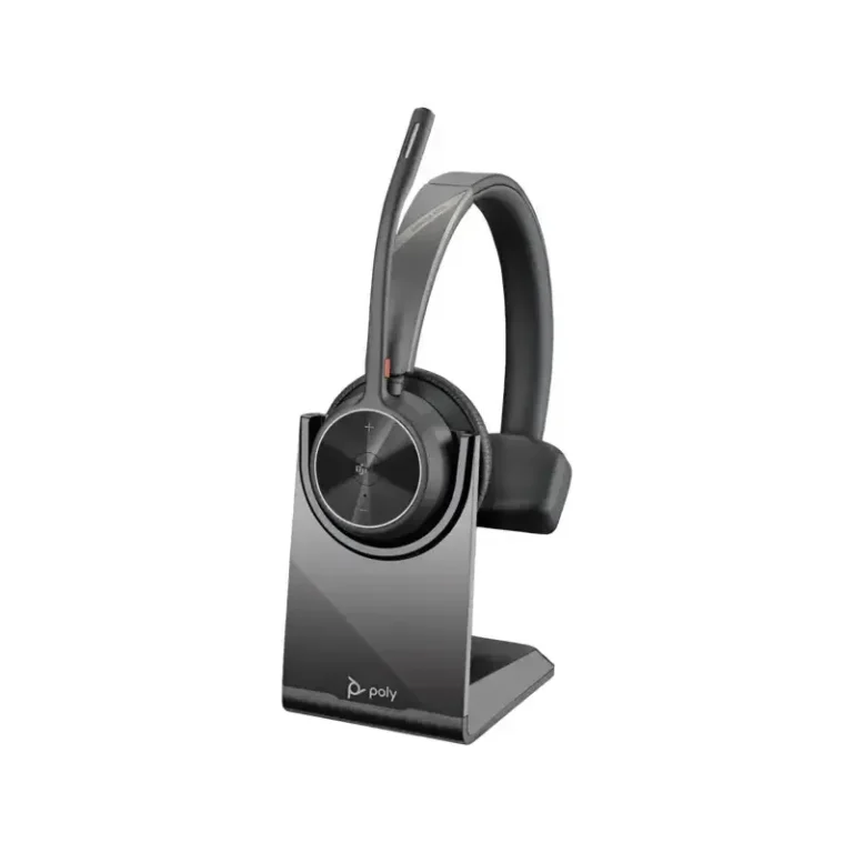 Poly Voyager 4310 M Teams USB-C headset with upright boom microphone resting on a black desktop charging stand.