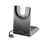 Poly Voyager USB-A charging stand with vertical glossy black dock panel, gold contact pins, and attached cable.